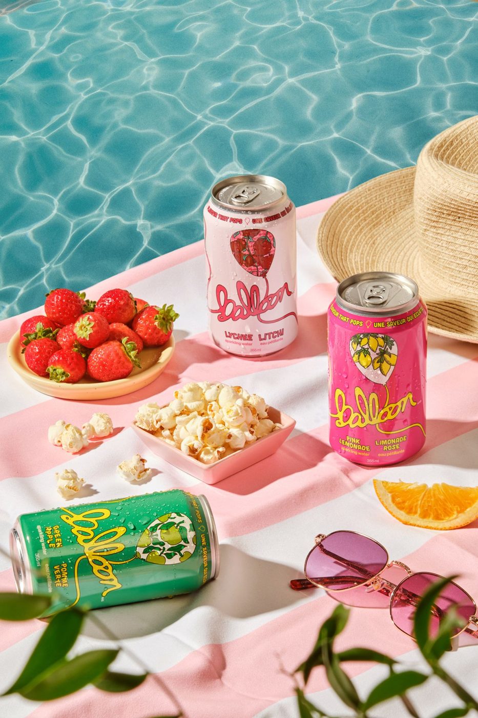 Balloon sparkling water cans by the pool. Social media templates and website by Mas Joy Studio